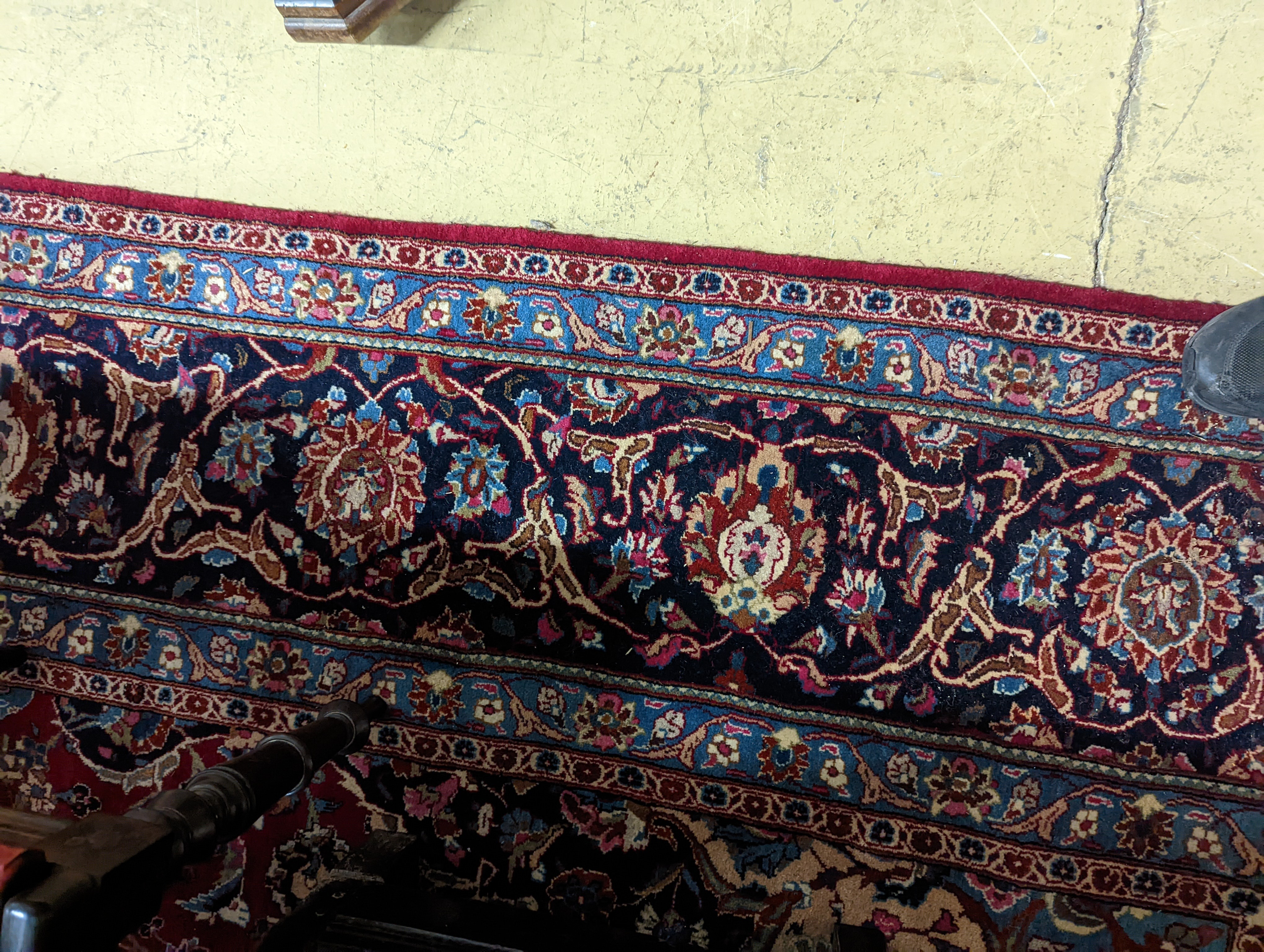 A Kashan burgundy ground carpet, 380 x 300cm